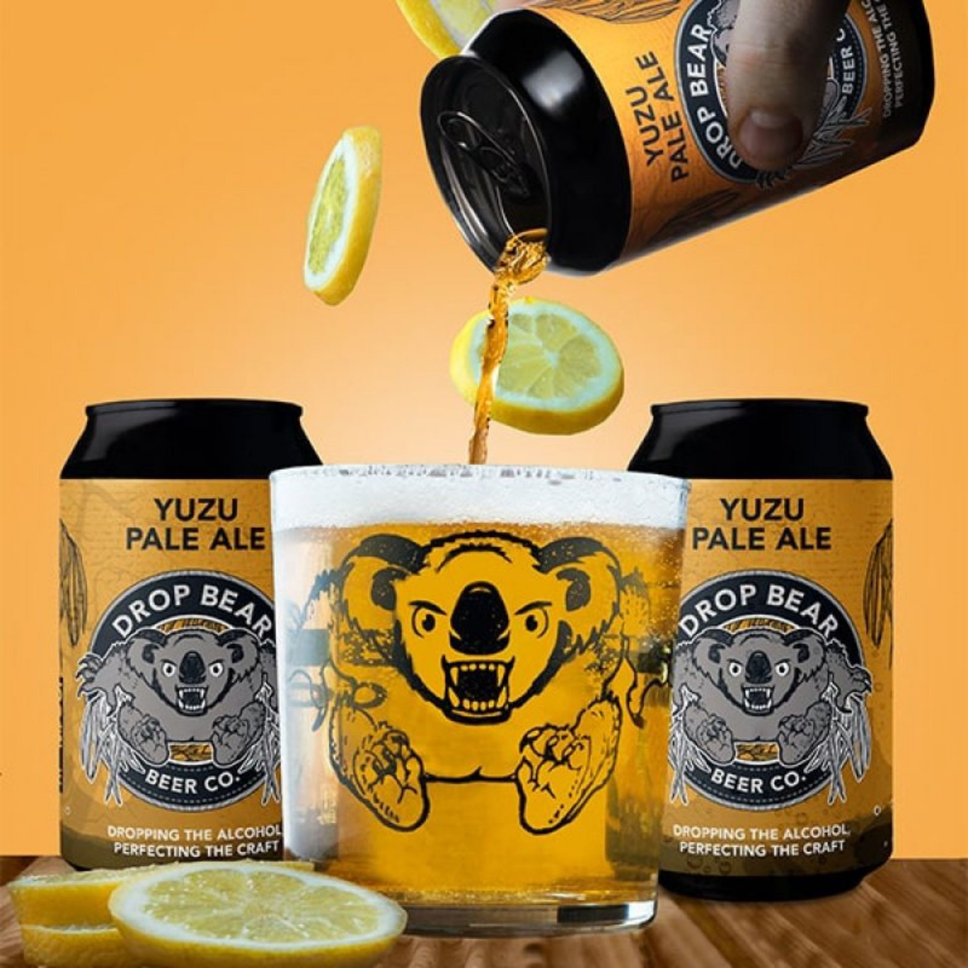 Yuzu Pale Ale being poured from a can into a glass with lemon slices on an orange background.
