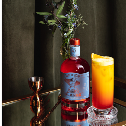 Lyre's Italian Spirits bottle with a cocktail on a reflective surface