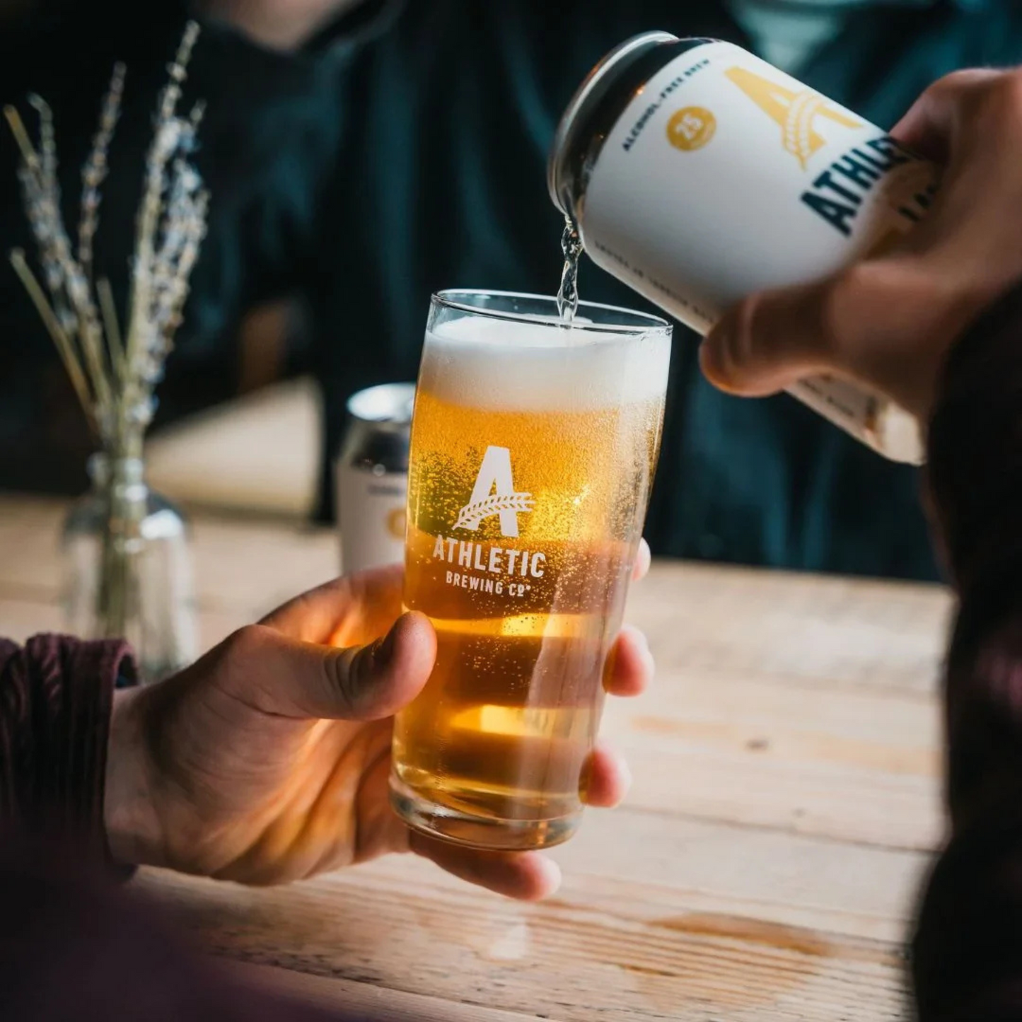 Athletic Brewing - Lager Can pouring in glass