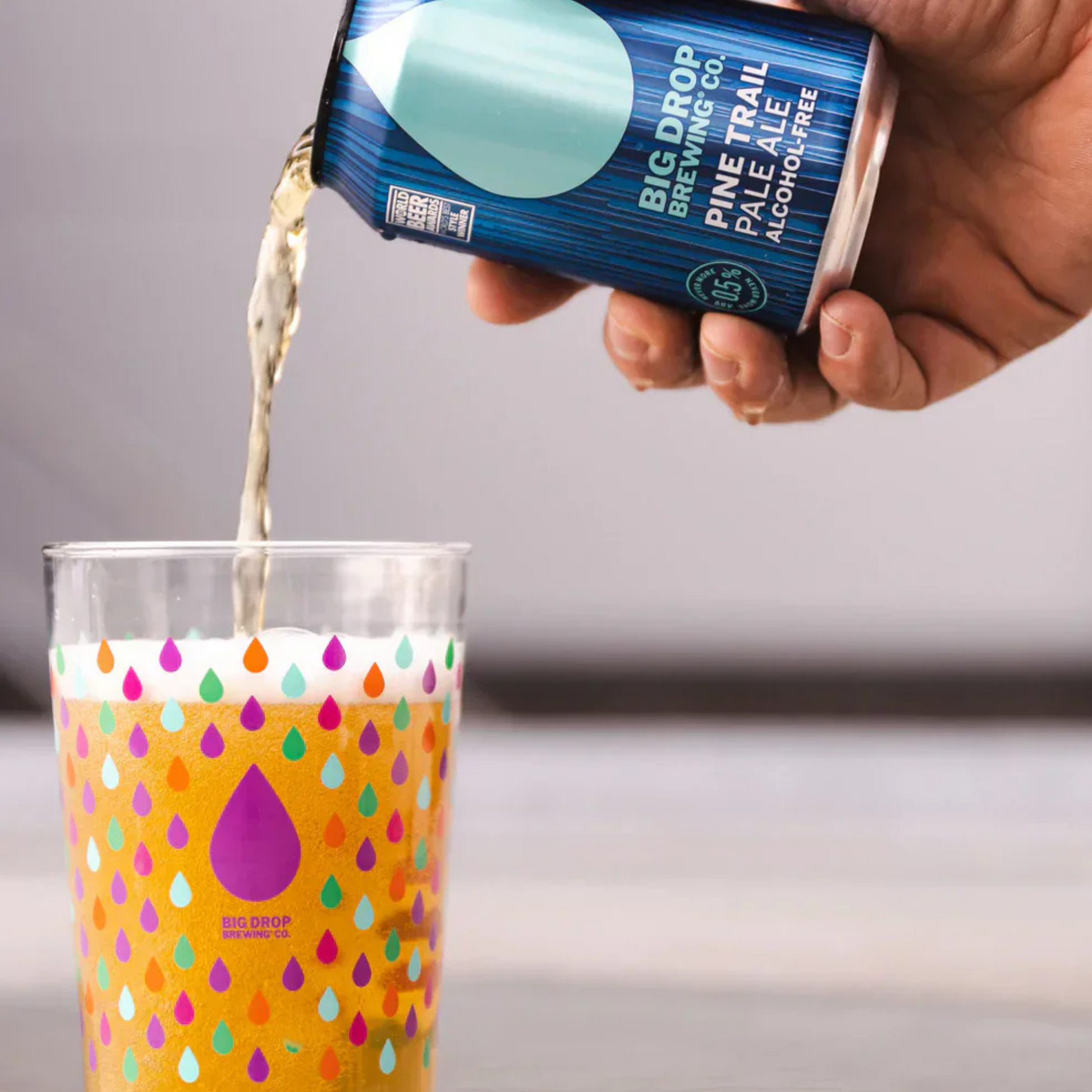 Big Drop Pine Trail Pale Ale Can pouring into class